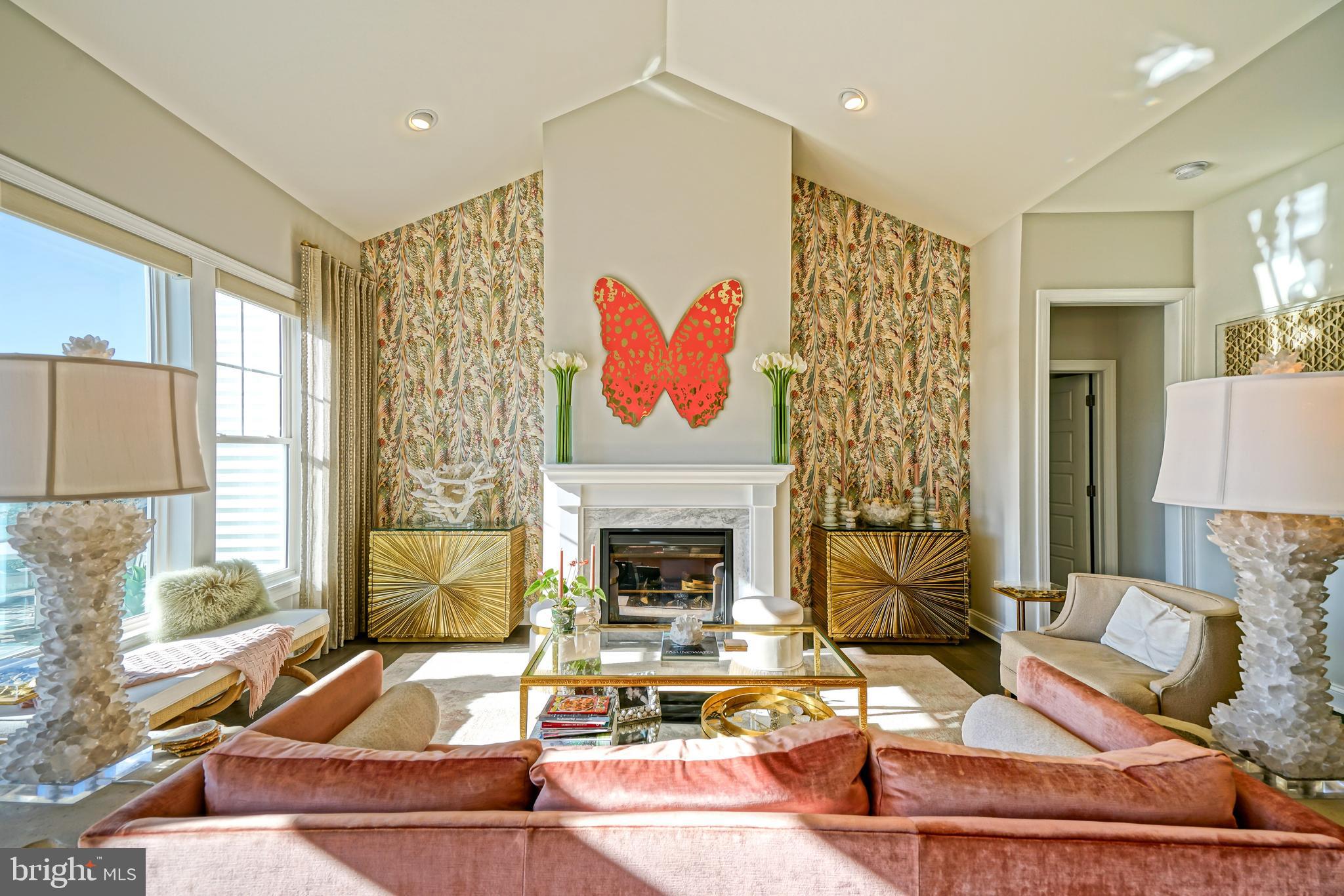 11078 Marvil Road Lewes, DE 19958 - Photo 17 of 98 a living room with furniture fireplace and a large window