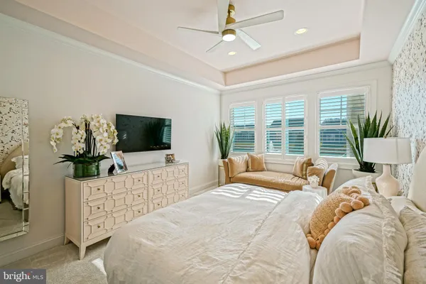 a living room with furniture a window and a table