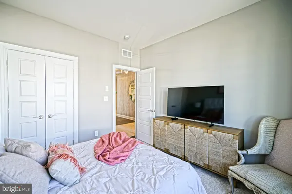 a view of a livingroom with furniture and a window