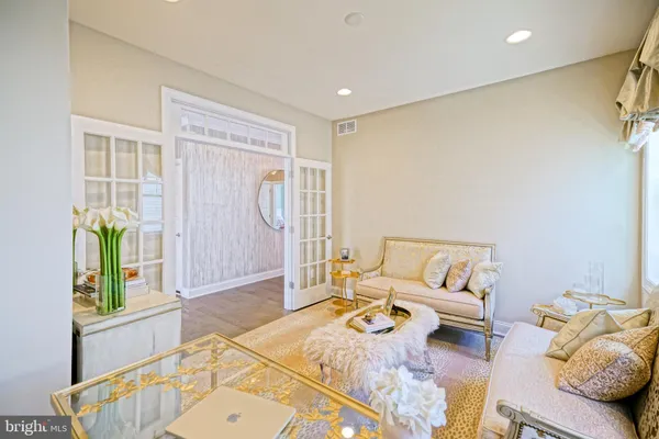 a view of a house with backyard sitting area and porch