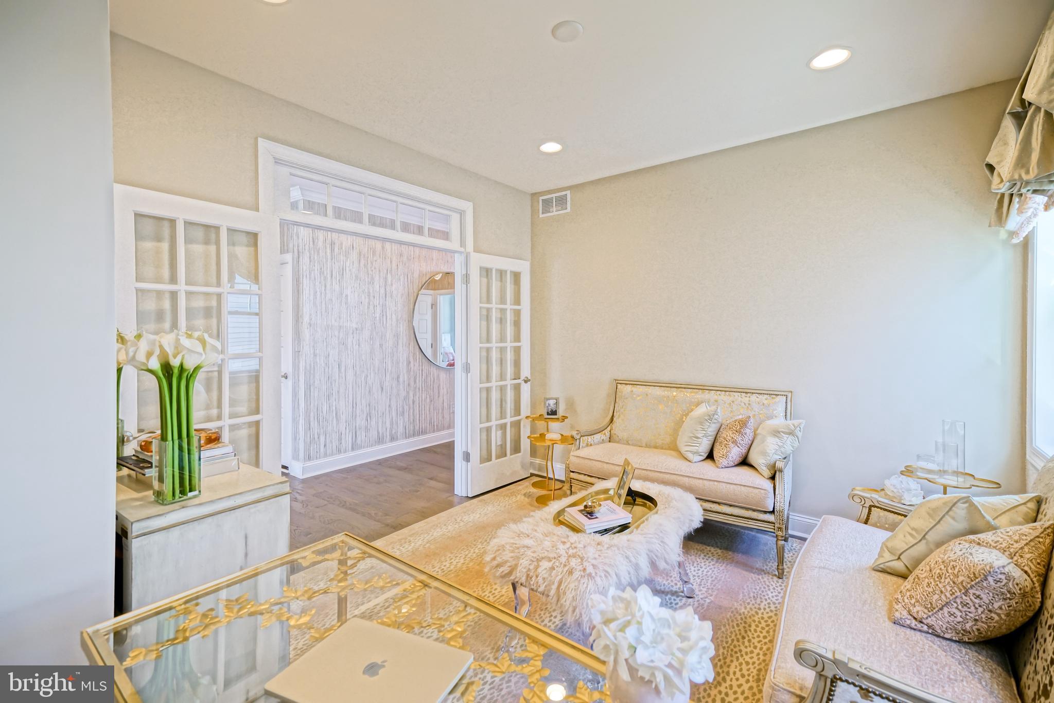 11078 Marvil Road Lewes, DE 19958 - Photo 44 of 98 a living room with furniture and a wooden floor