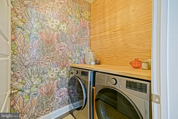 a front view of a house with a yard outdoor seating and livingroom