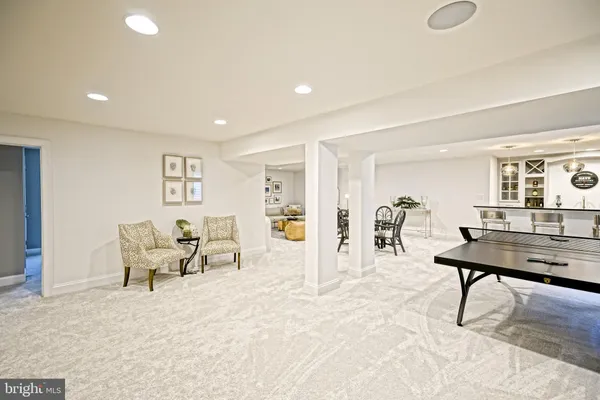 a living room with lots of furniture and flat screen tv