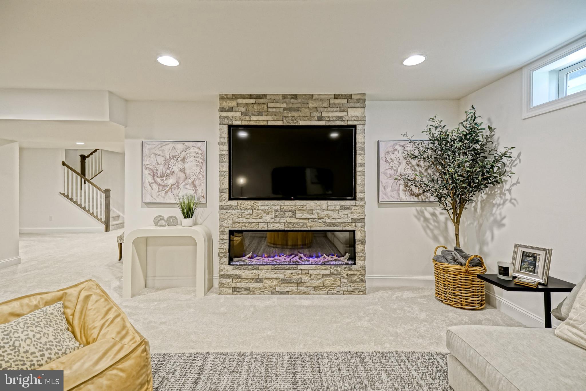 11078 Marvil Road Lewes, DE 19958 - Photo 53 of 98 a living room with furniture and a fireplace