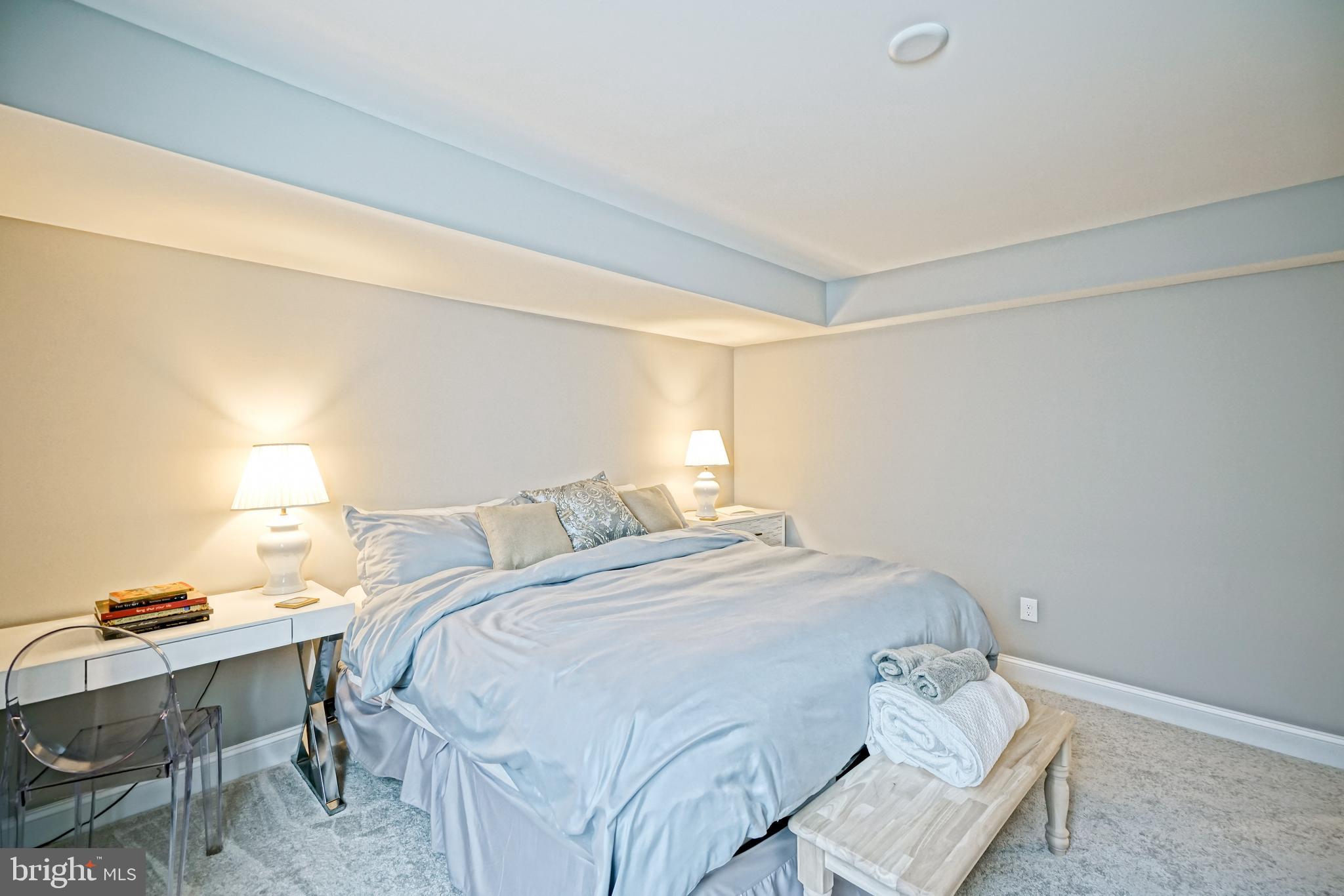 11078 Marvil Road Lewes, DE 19958 - Photo 68 of 98 a bedroom with a bed and a desk