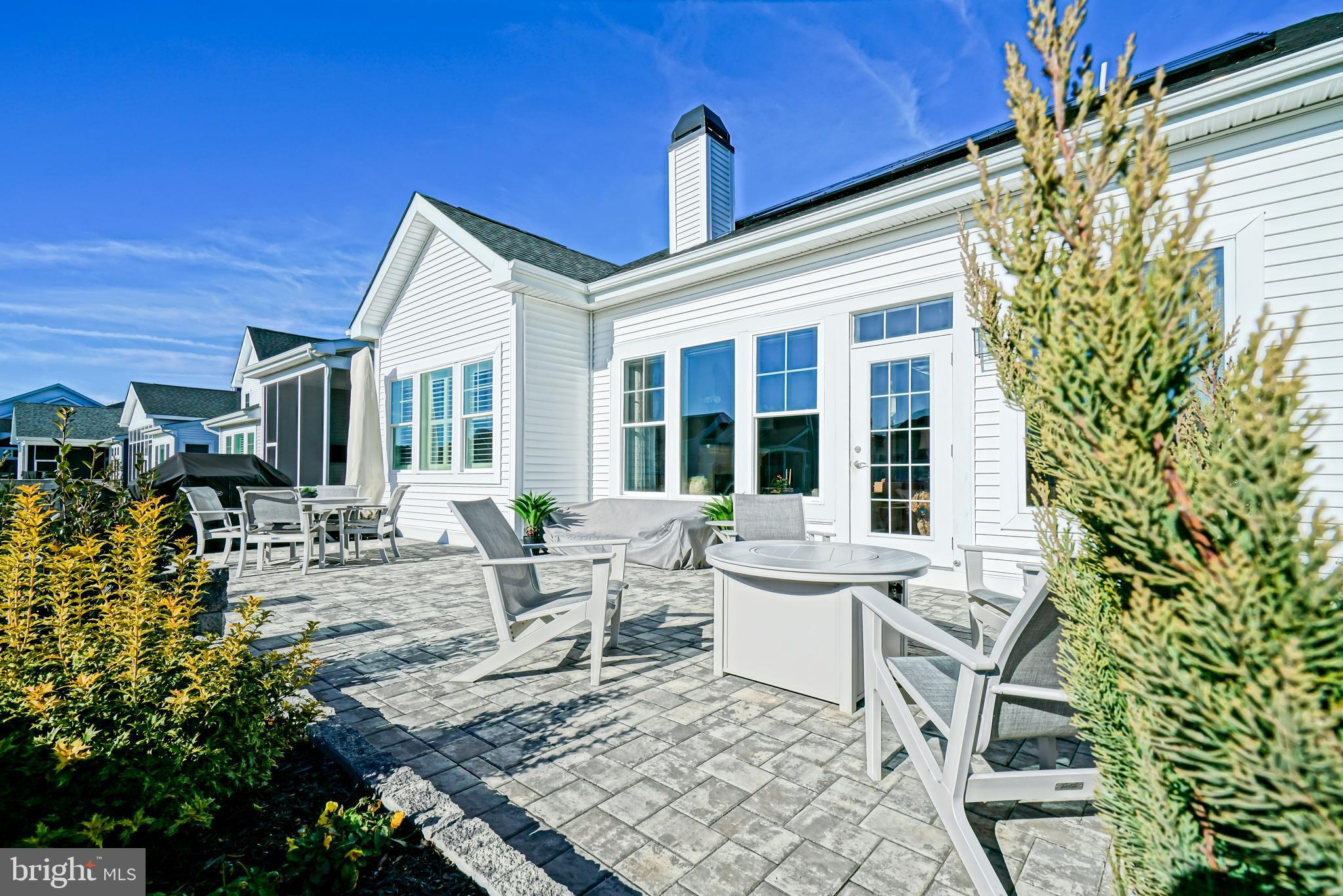 11078 Marvil Road Lewes, DE 19958 - Photo 79 of 98 a view of a house with backyard sitting area and porch