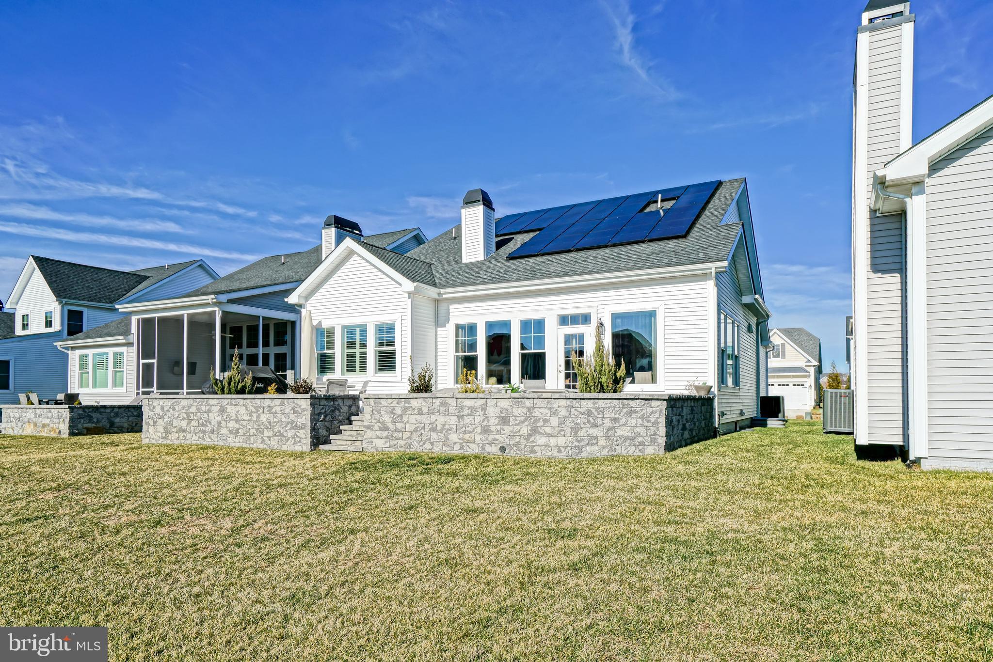 11078 Marvil Road Lewes, DE 19958 - Photo 83 of 98 a front view of a house with a yard
