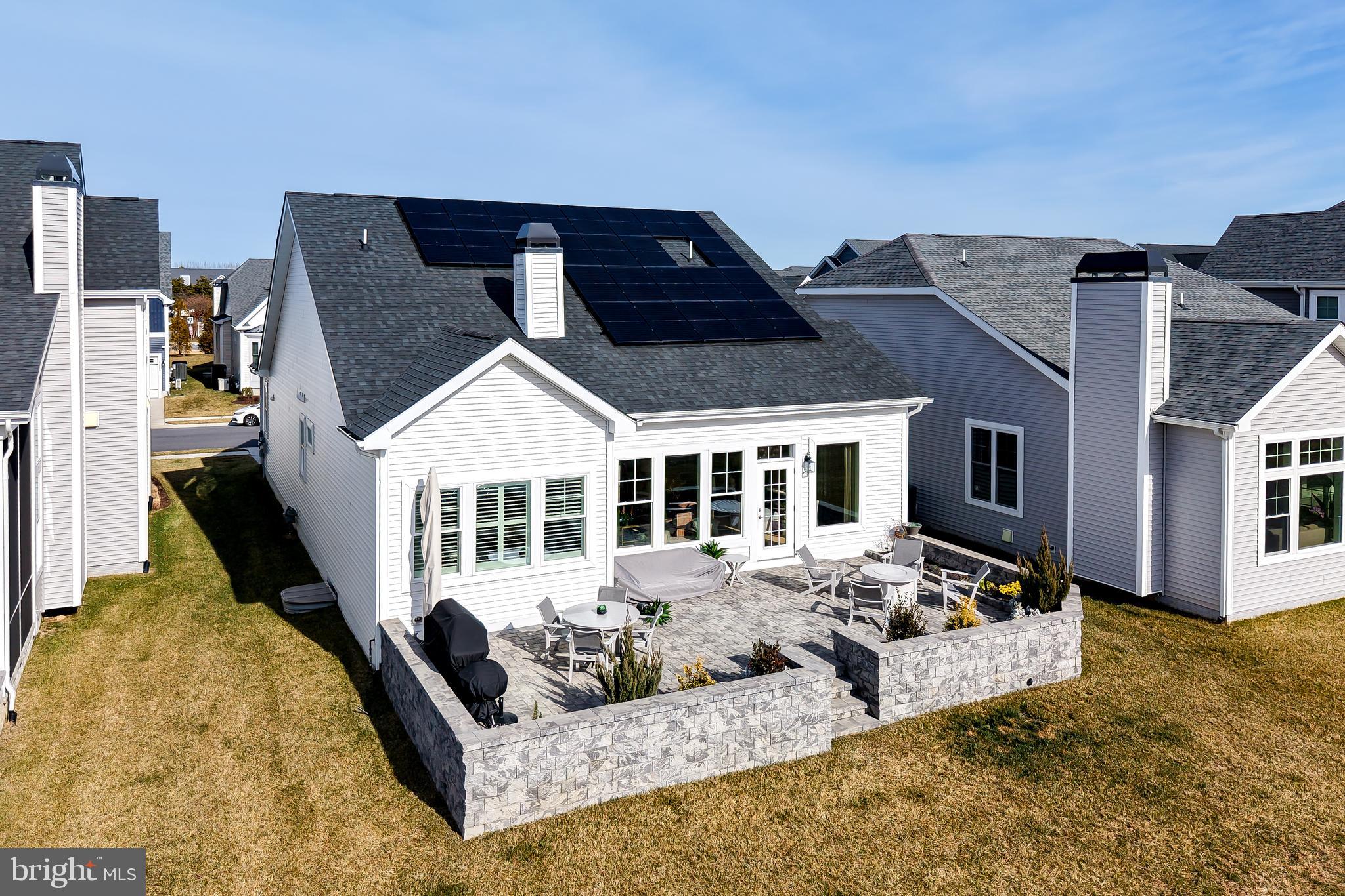 11078 Marvil Road Lewes, DE 19958 - Photo 85 of 98 a front view of a house with a yard outdoor seating and livingroom