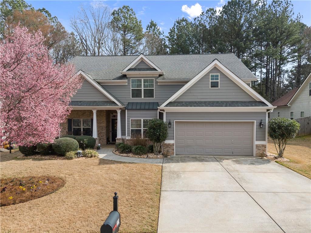 221 Spinner Drive Jefferson, GA 30549 - Photo 1 of 1 a front view of a house with a yard and garage