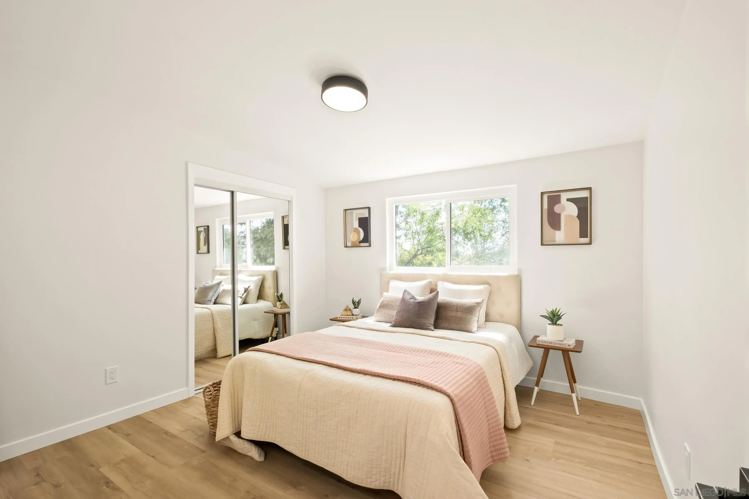 557 Sunset Drive Vista, CA 92081 - Photo 18 of 36 a bedroom with a bed and a window