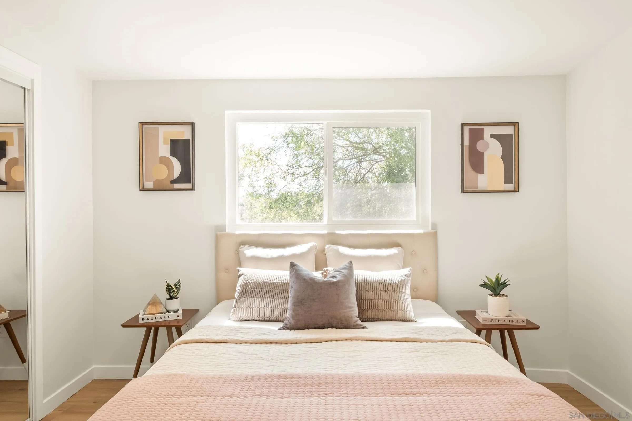 557 Sunset Drive Vista, CA 92081 - Photo 19 of 36 a large white bed sitting in a bathroom next to a window