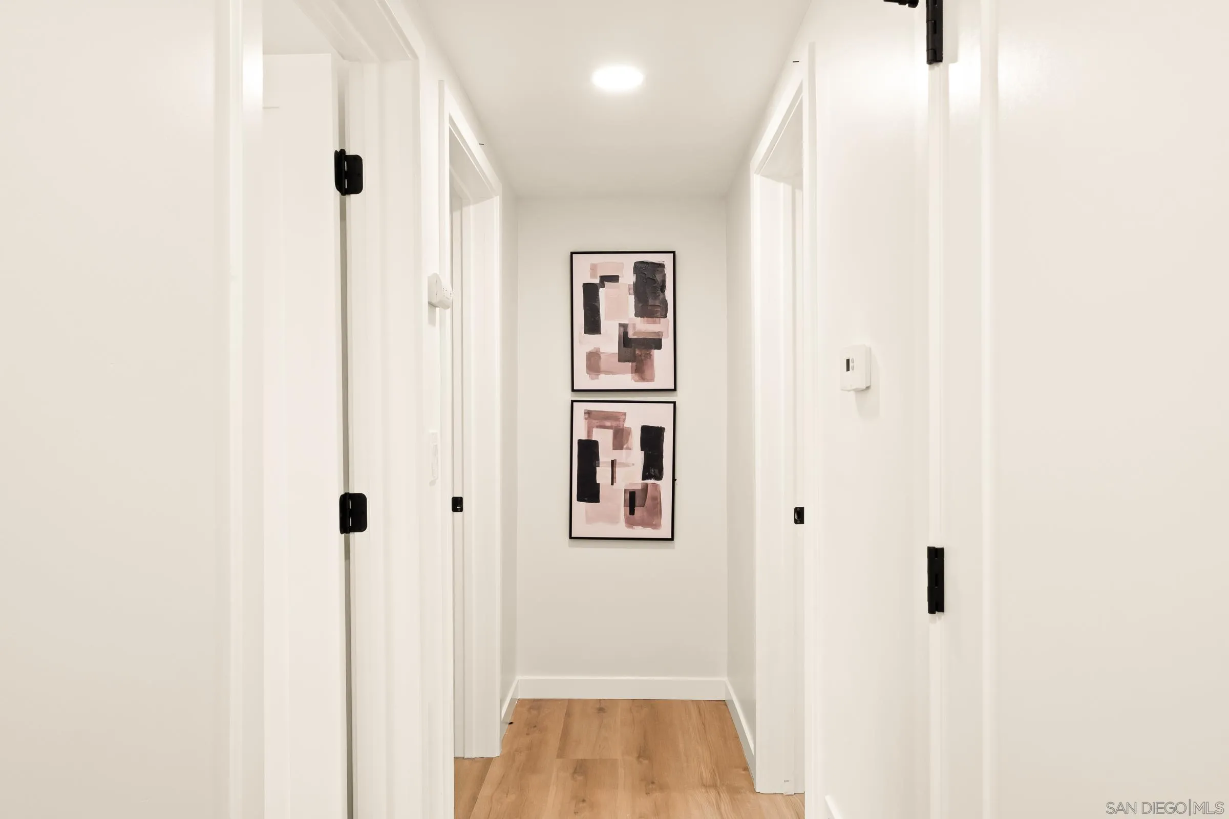 557 Sunset Drive Vista, CA 92081 - Photo 20 of 36 a view of a hallway with closet