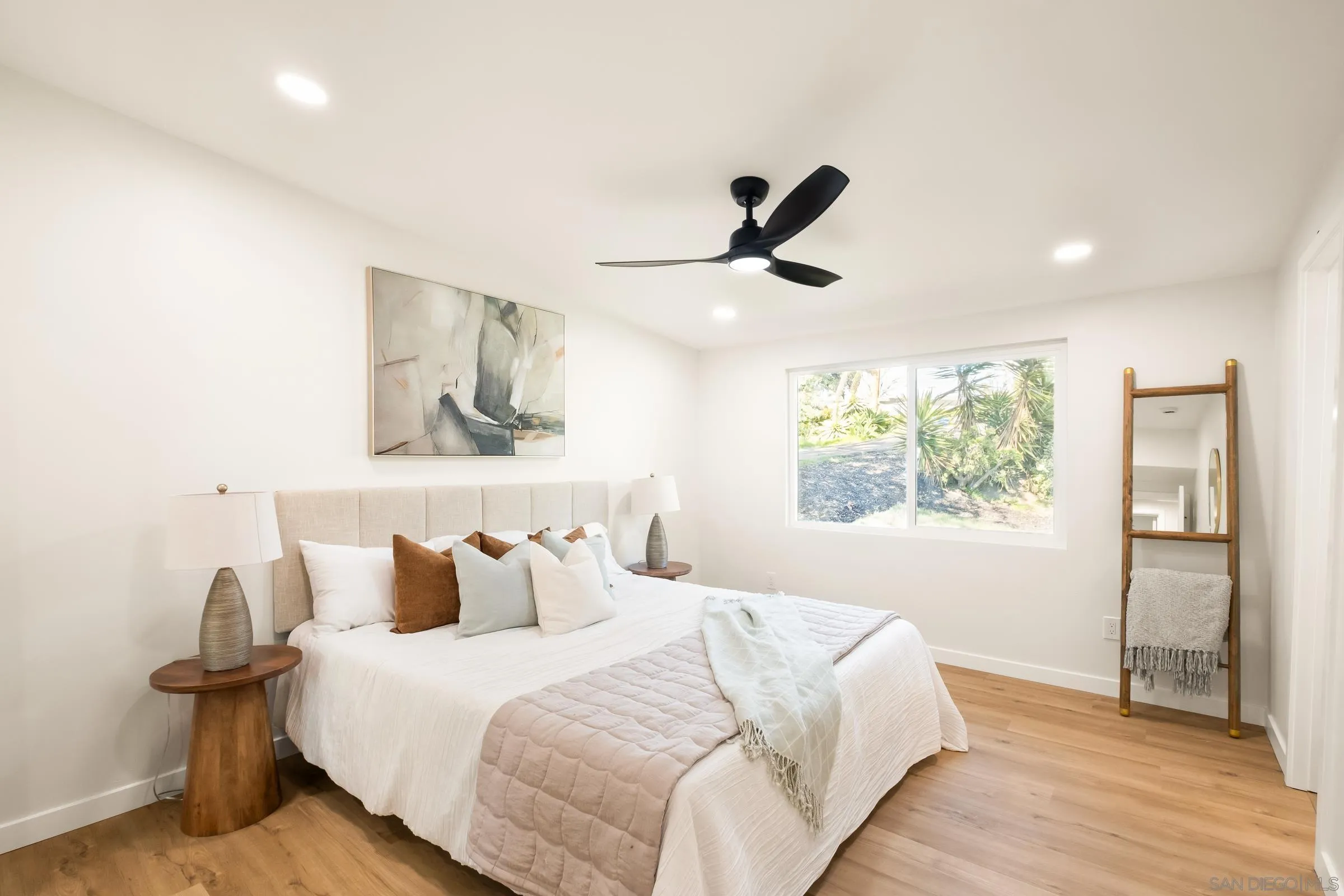 557 Sunset Drive Vista, CA 92081 - Photo 23 of 36 a bedroom with a bed and a window