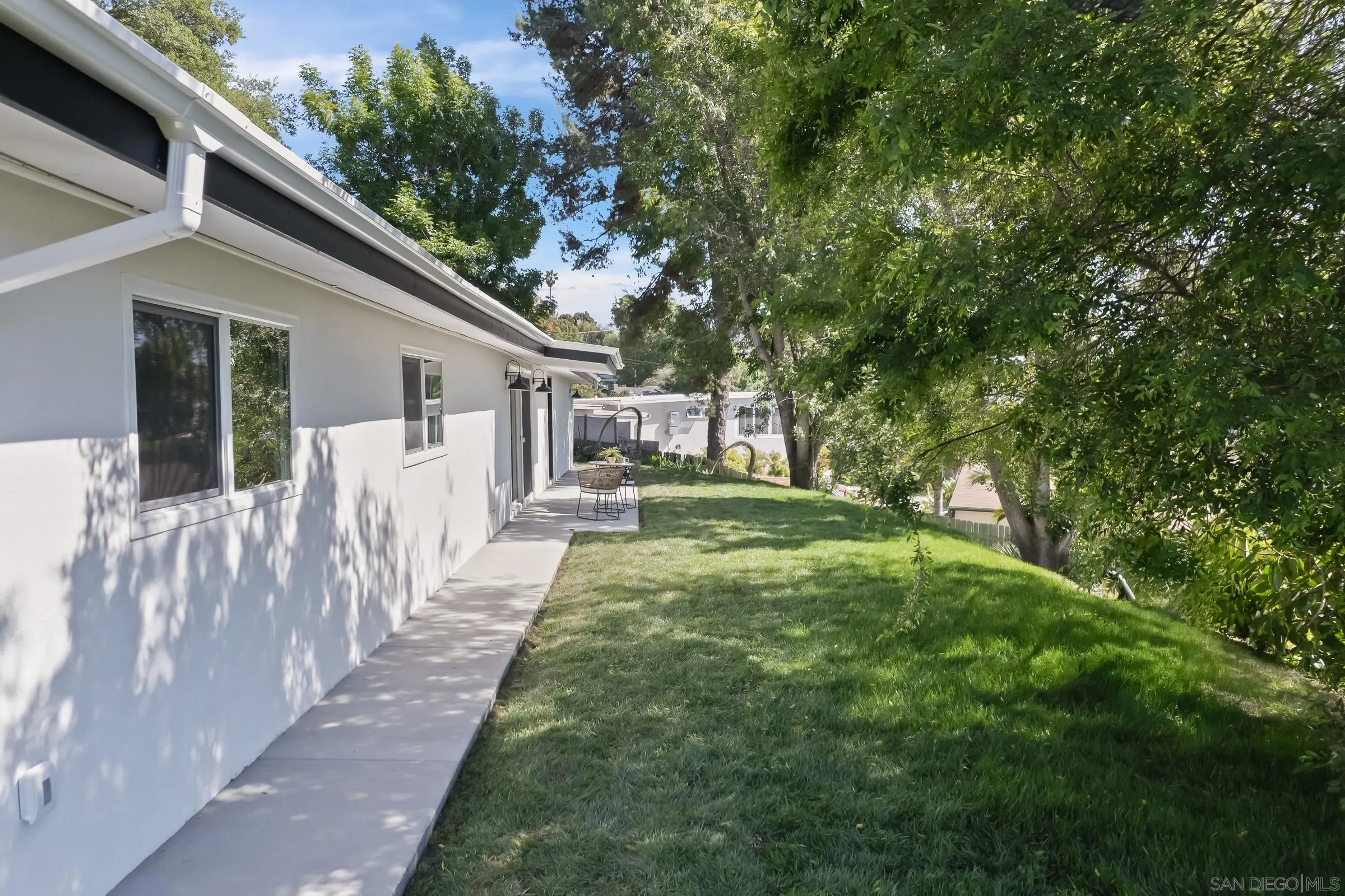 557 Sunset Drive Vista, CA 92081 - Photo 29 of 36 a view of a house with yard and a garden
