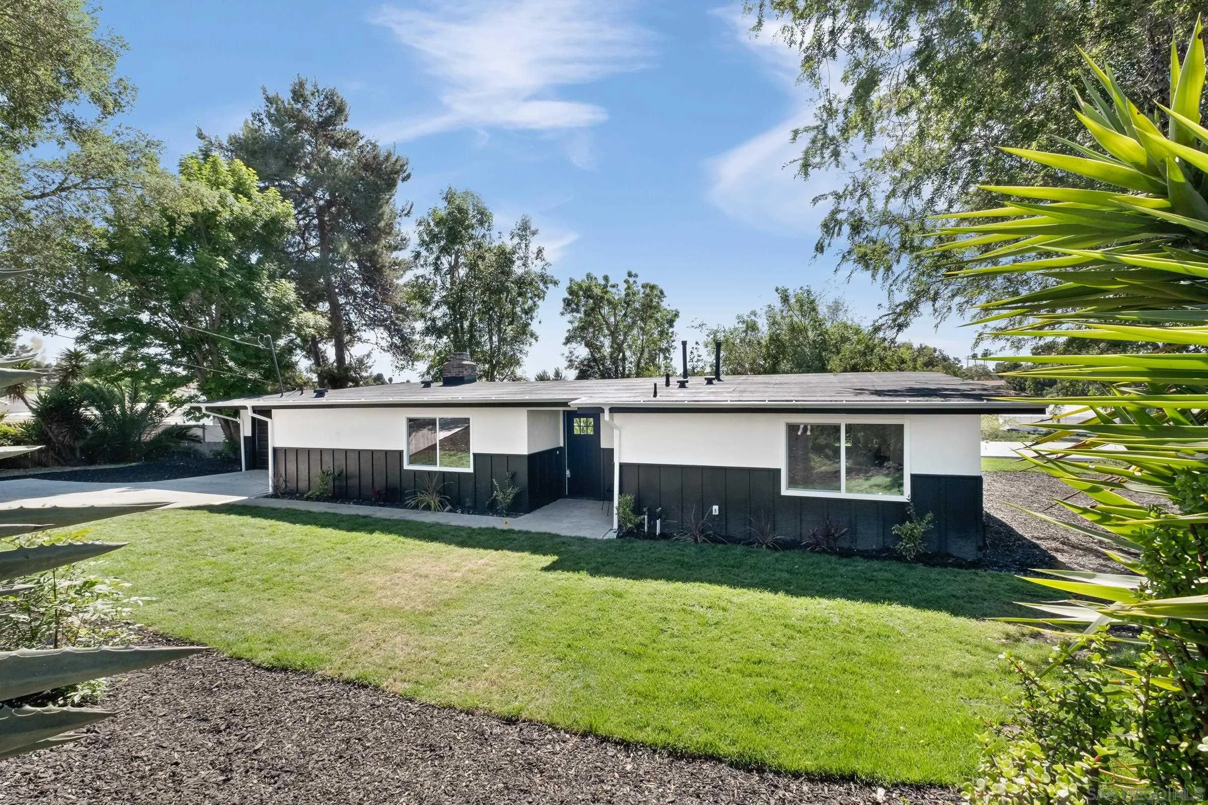 557 Sunset Drive Vista, CA 92081 - Photo 3 of 36 a view of a house with a yard