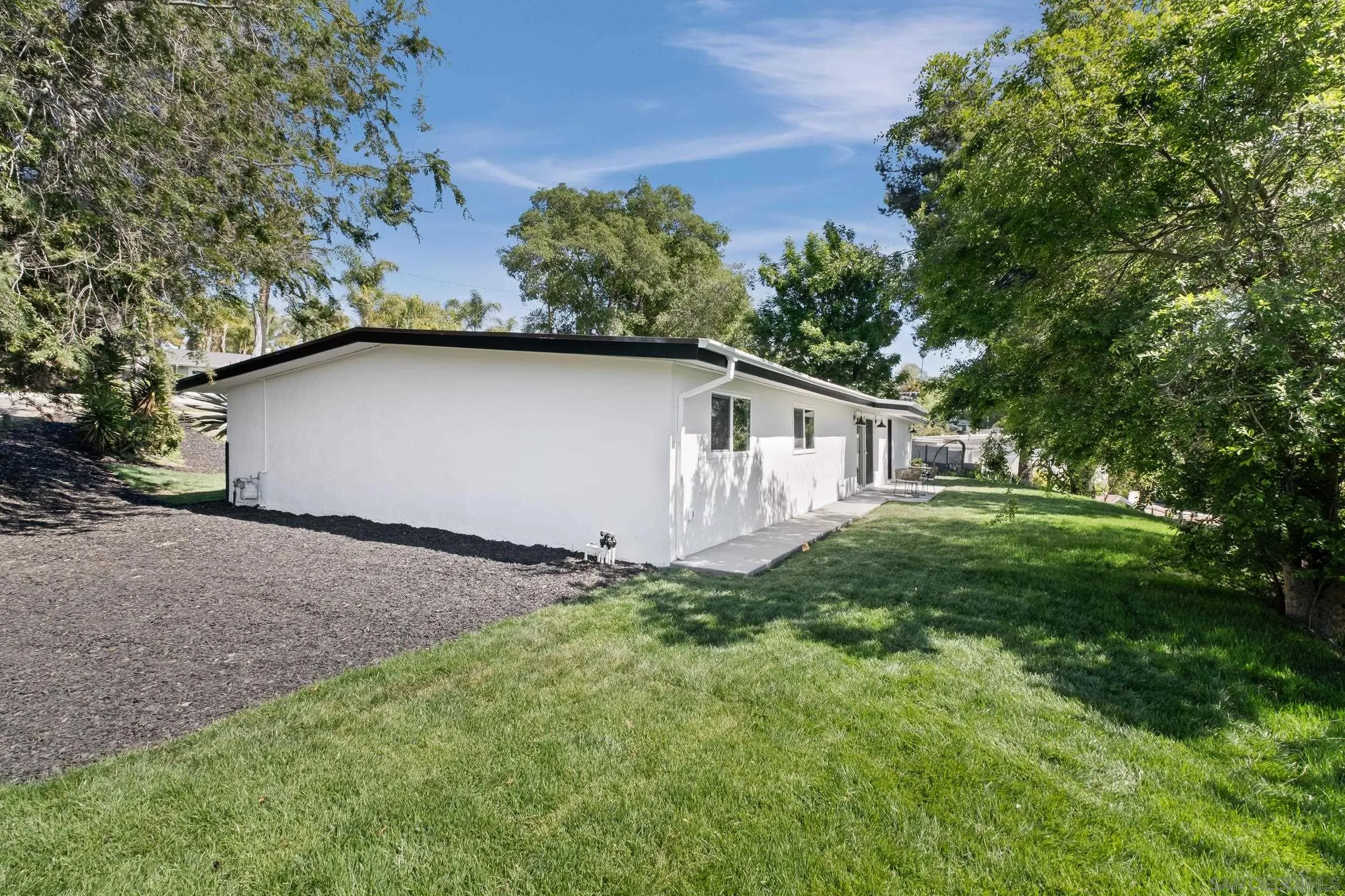 557 Sunset Drive Vista, CA 92081 - Photo 31 of 36 a view of a house with backyard and garden