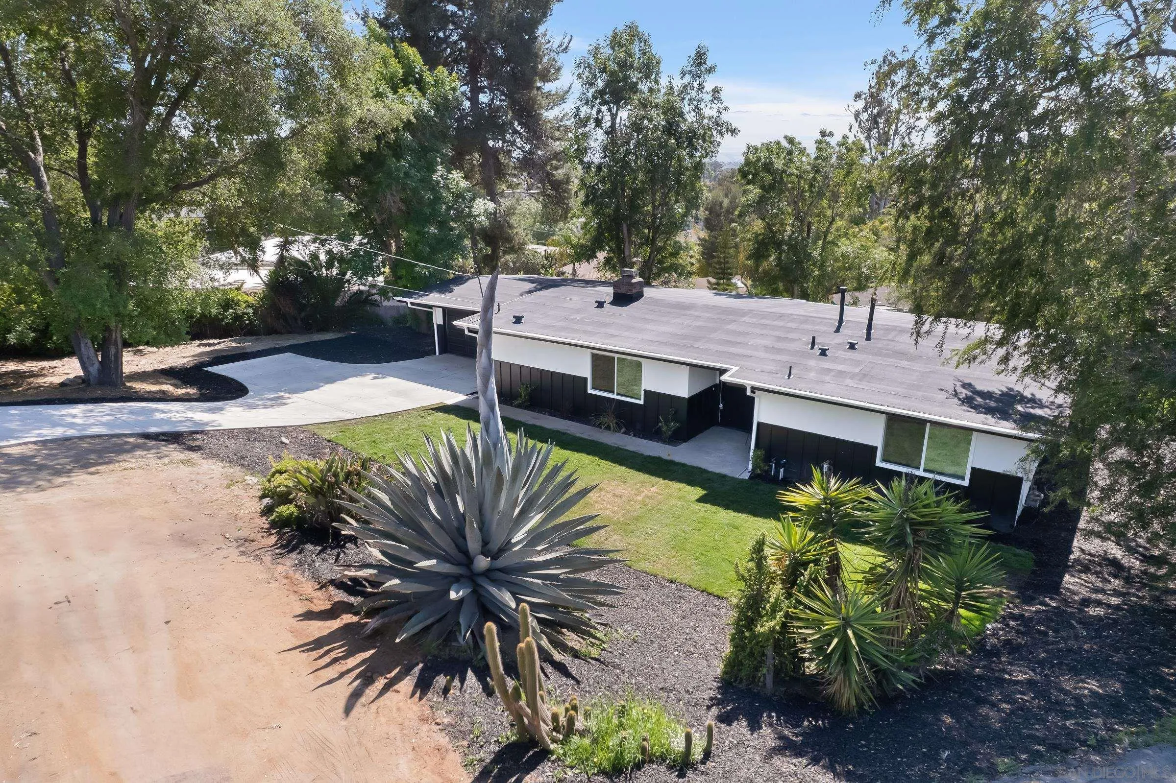 557 Sunset Drive Vista, CA 92081 - Photo 32 of 36 a view of a house with pool and chairs