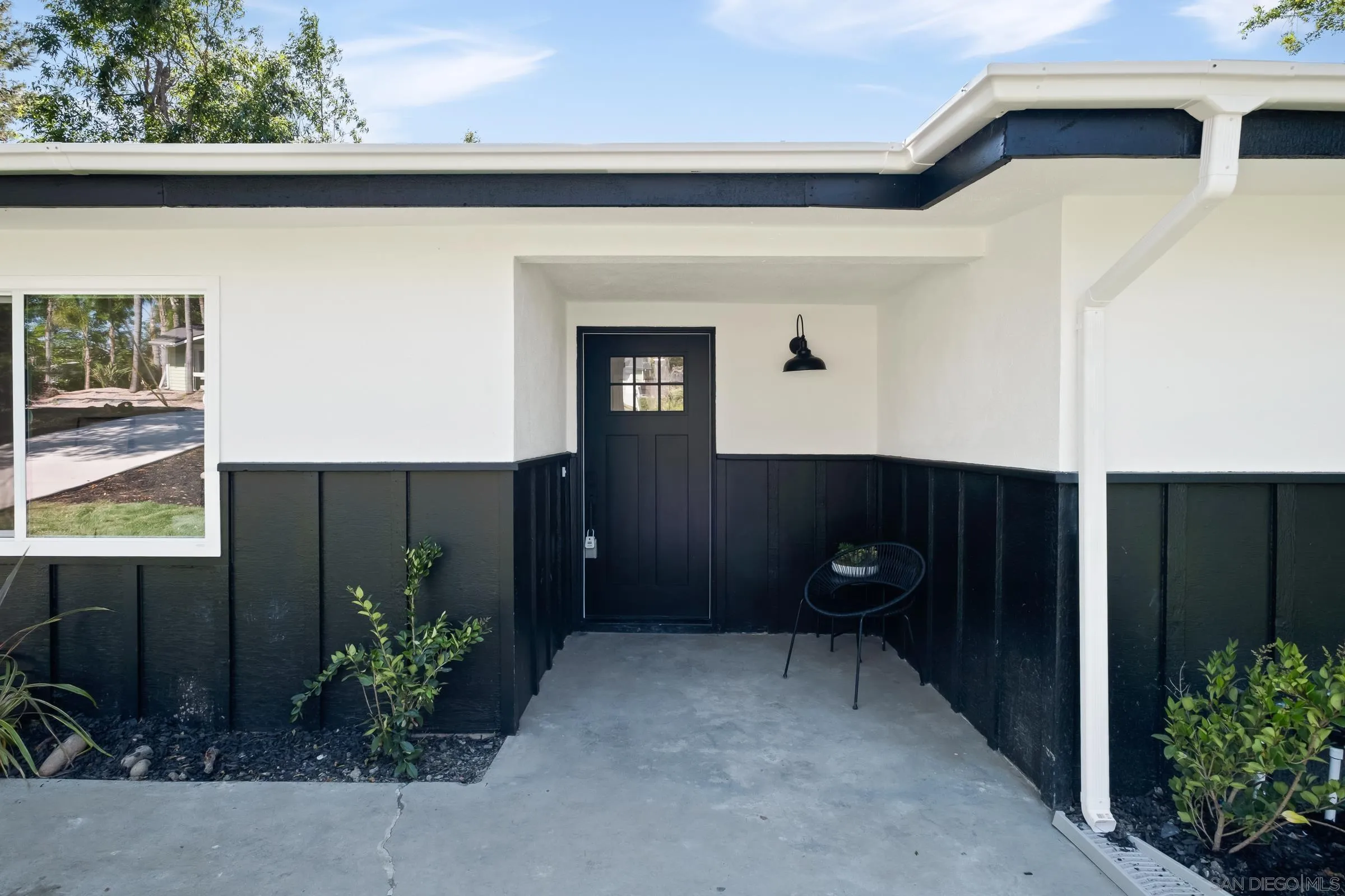 557 Sunset Drive Vista, CA 92081 - Photo 6 of 36 a backyard of a house with plants and outdoor seating