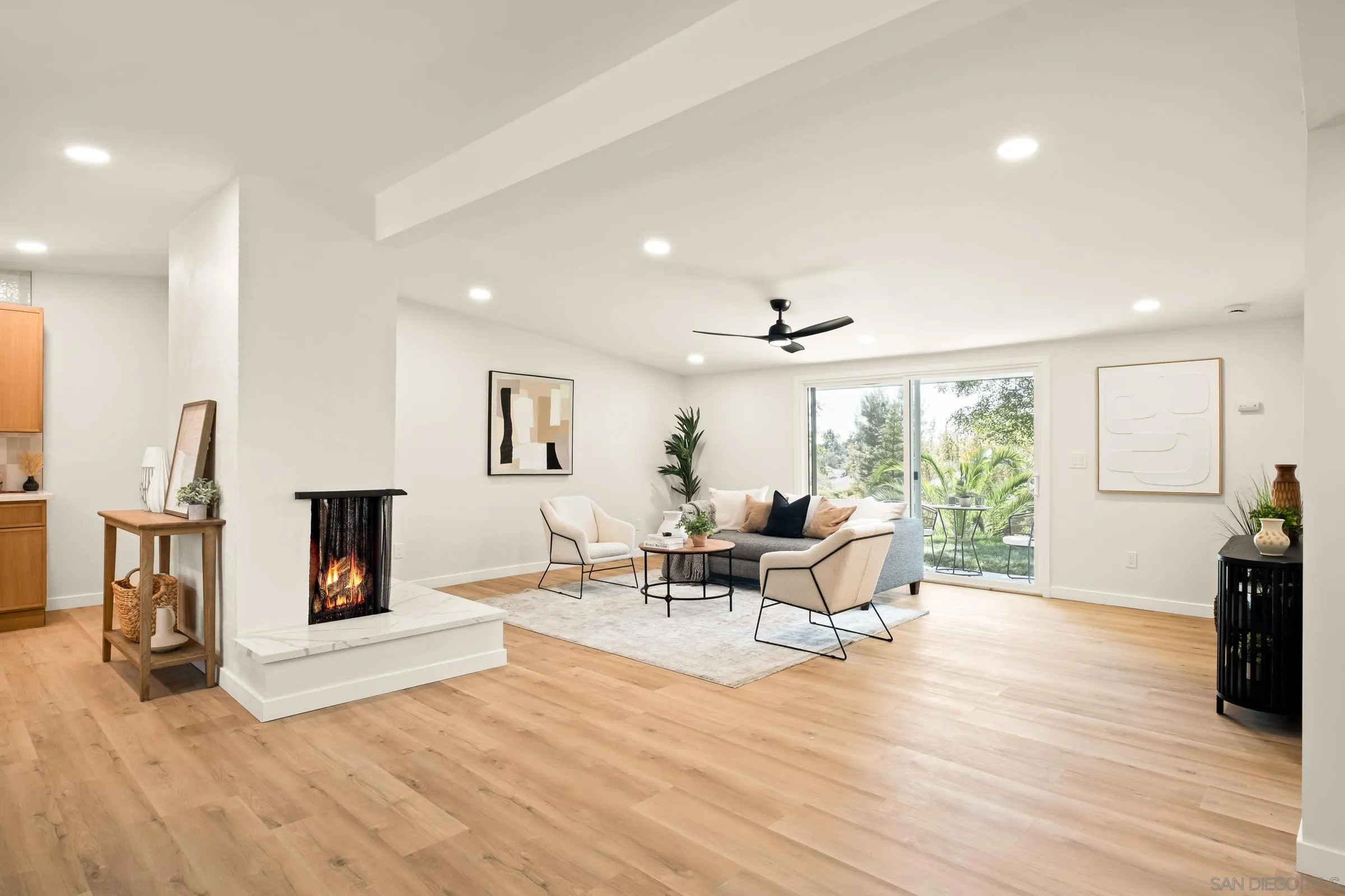 557 Sunset Drive Vista, CA 92081 - Photo 7 of 36 a living room with furniture and a fireplace