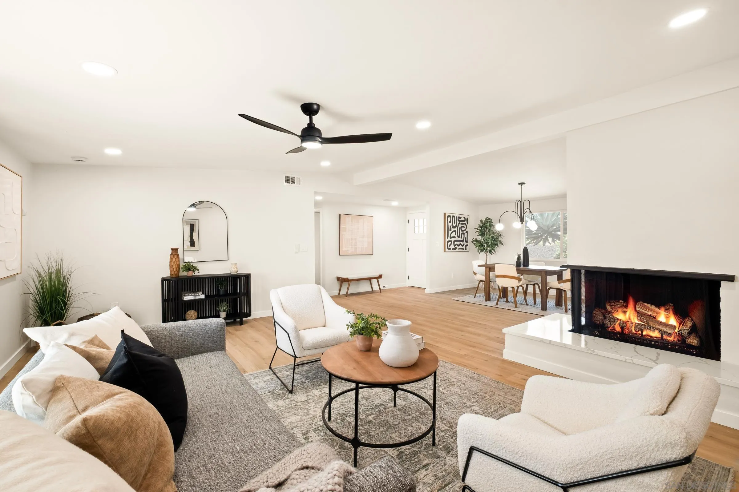 557 Sunset Drive Vista, CA 92081 - Photo 8 of 36 a living room with furniture and a fireplace