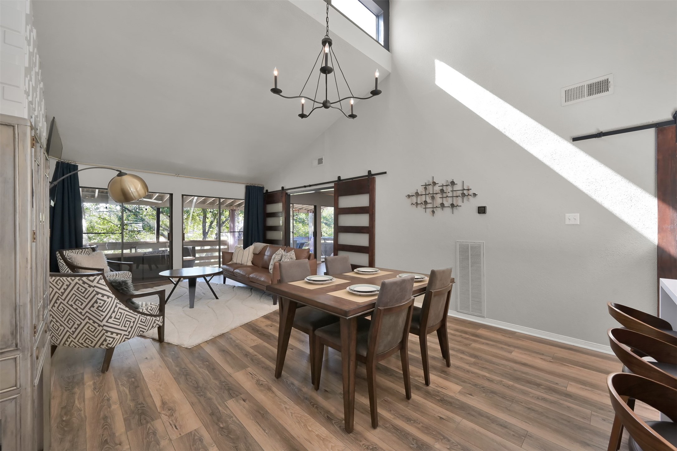 184 April Point Drive North Conroe, TX 77356 - Photo 11 of 41 Overhead windows allow for lots of natural lighting, in addition to the large patio doors