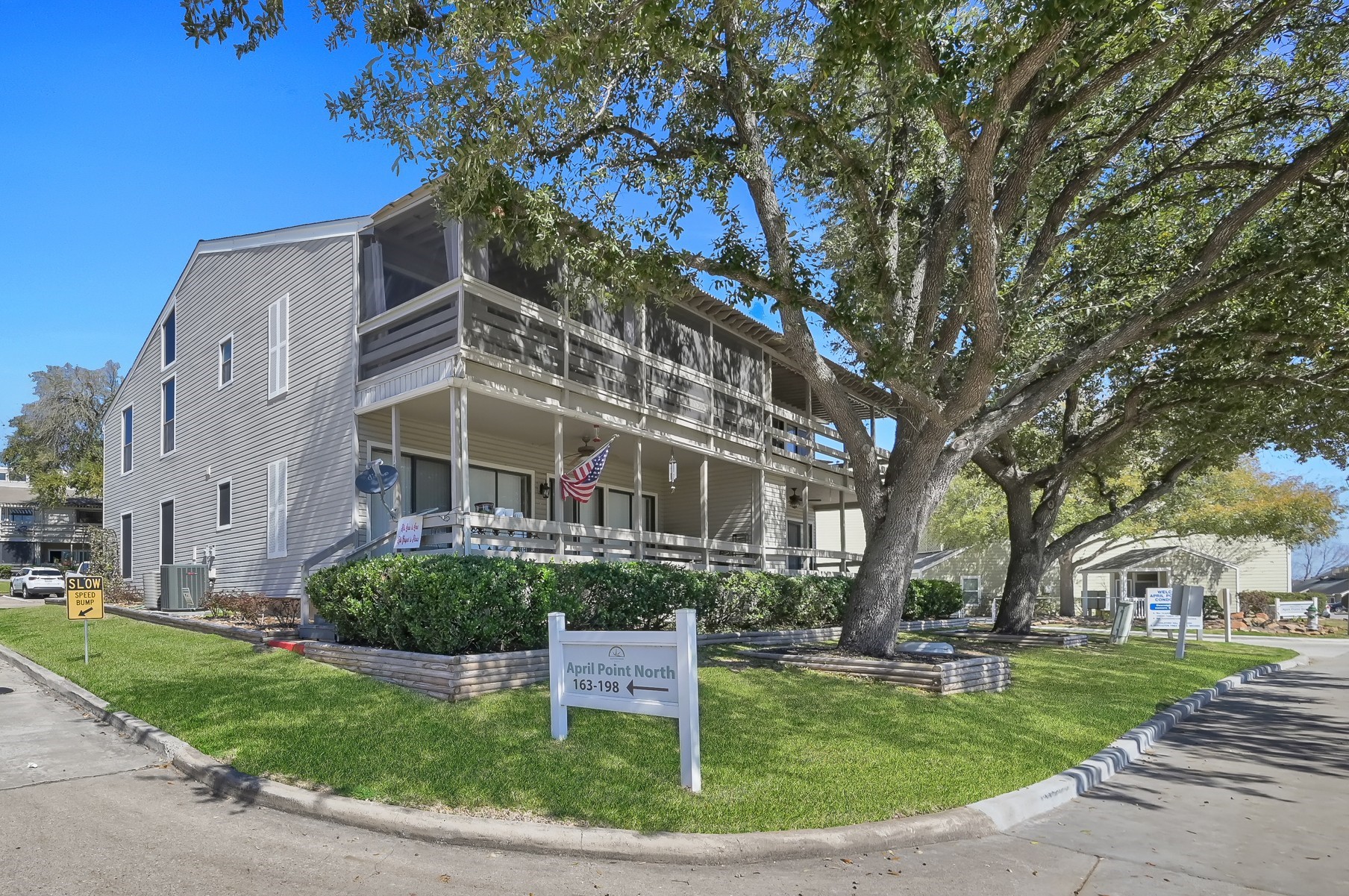 184 April Point Drive North Conroe, TX 77356 - Photo 2 of 41 The twin shade trees are a great landmark to guide you home