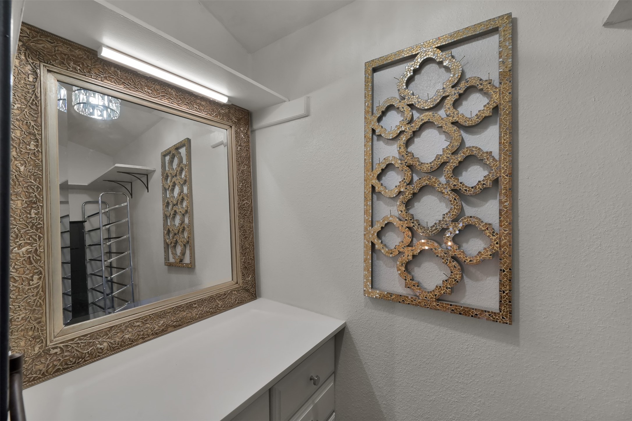 184 April Point Drive North Conroe, TX 77356 - Photo 28 of 41 Makeup closet with quartz counter and chandelier