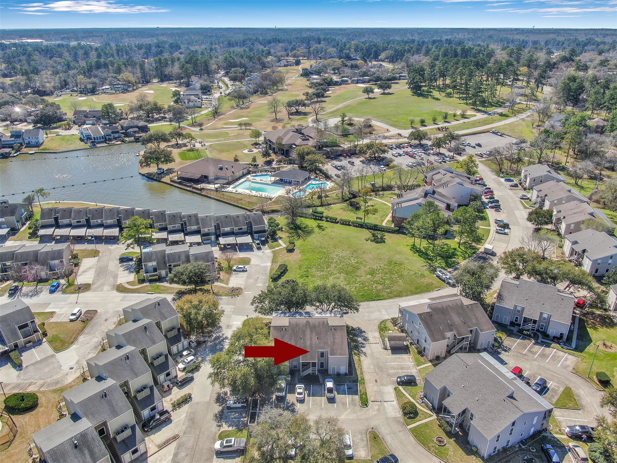 184 April Point Drive North Conroe, TX 77356 - Photo 36 of 41 From here you can see the country club in the middle of the picture with the 3 pools, the "floating" driving range and parts of the three 9-hole golf courses.
