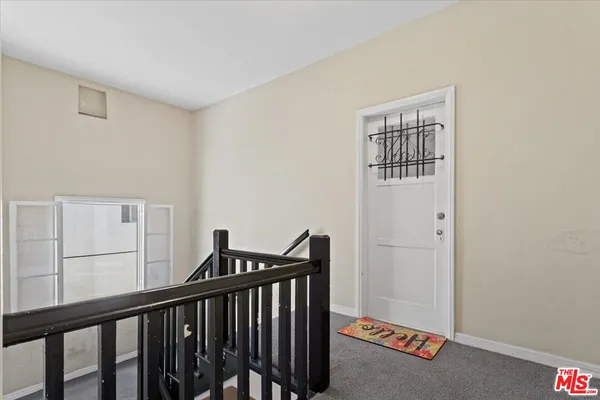 a view of a hallway with workspace