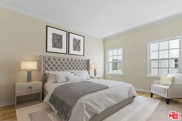 a bedroom with a bed and a couch