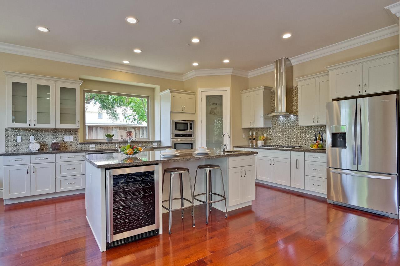 932 Marion Way Sunnyvale, CA 94087 - Photo 11 of 47 a kitchen with white cabinets and appliances