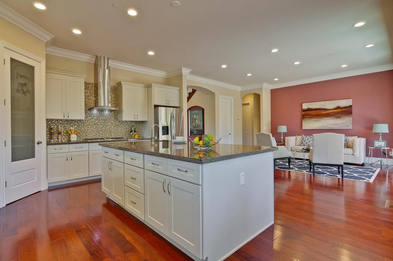 932 Marion Way Sunnyvale, CA 94087 - Photo 12 of 47 a kitchen with granite countertop a stove and chairs
