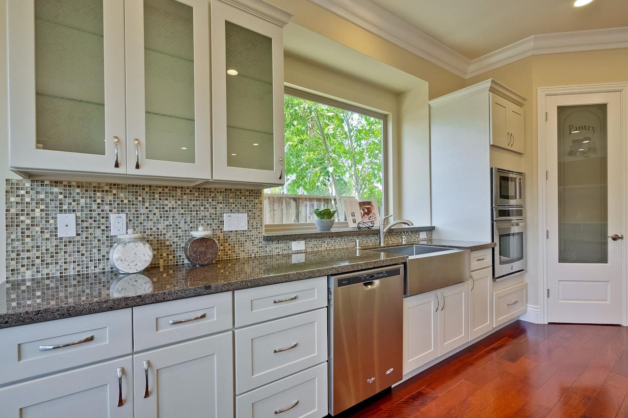 932 Marion Way Sunnyvale, CA 94087 - Photo 13 of 47 a kitchen with granite countertop stainless steel appliances a sink and cabinets