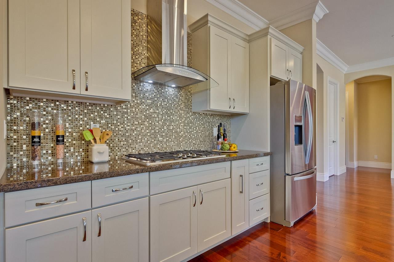 932 Marion Way Sunnyvale, CA 94087 - Photo 14 of 47 a kitchen with stainless steel appliances white cabinets and a sink