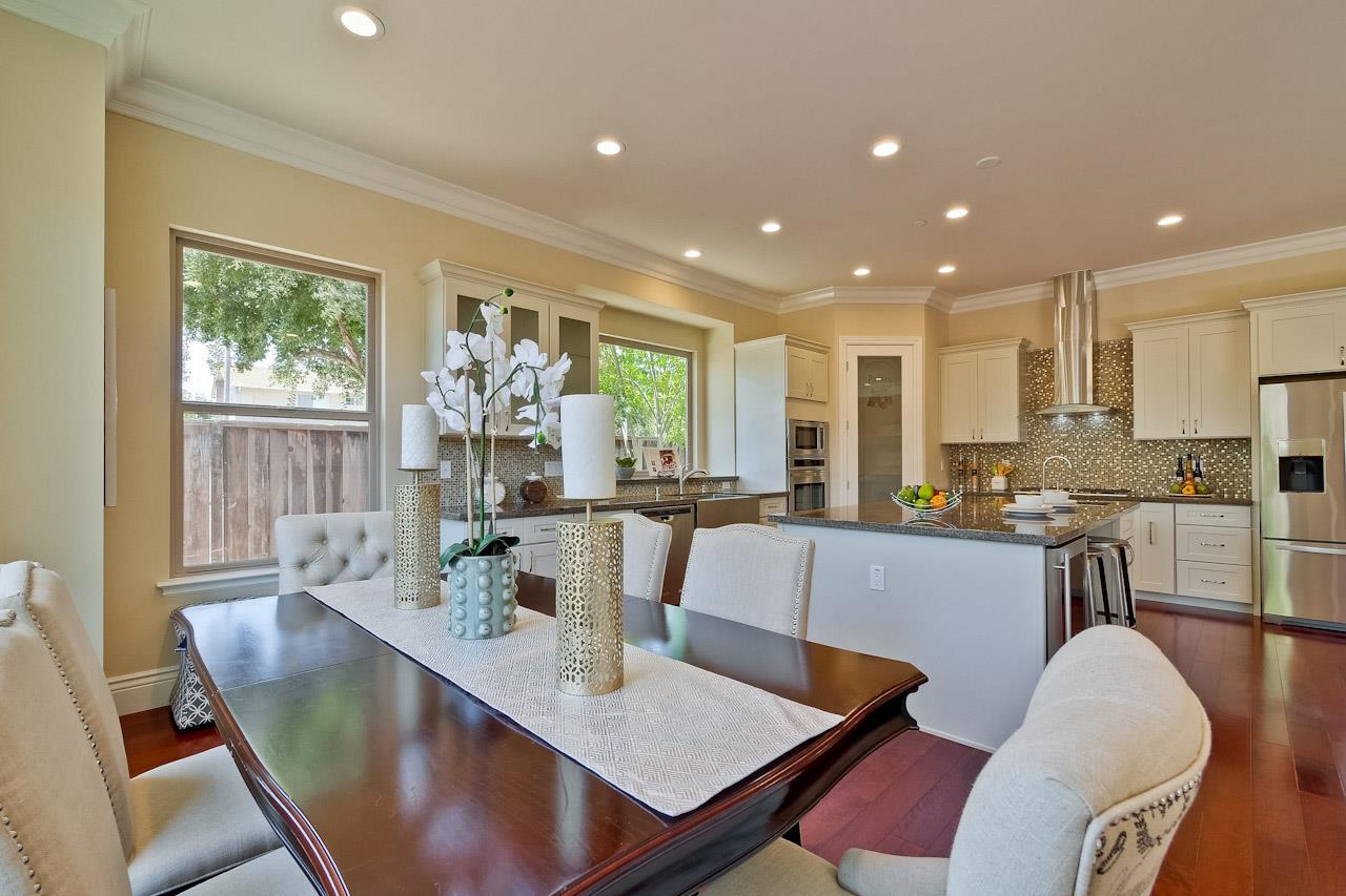 932 Marion Way Sunnyvale, CA 94087 - Photo 16 of 47 a large dining room with kitchen island furniture and a large window