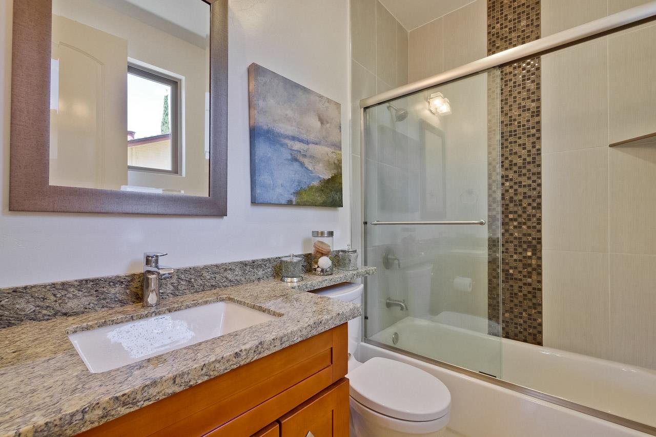932 Marion Way Sunnyvale, CA 94087 - Photo 27 of 47 a bathroom with a granite countertop sink toilet and shower
