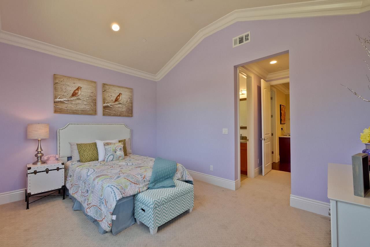 932 Marion Way Sunnyvale, CA 94087 - Photo 34 of 47 a bedroom with a bed and a painting on the wall