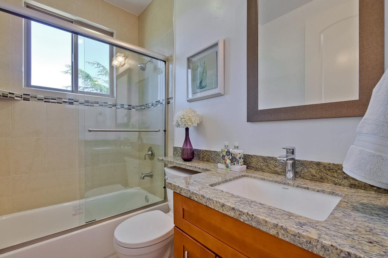932 Marion Way Sunnyvale, CA 94087 - Photo 35 of 47 a bathroom with a granite countertop sink toilet and shower