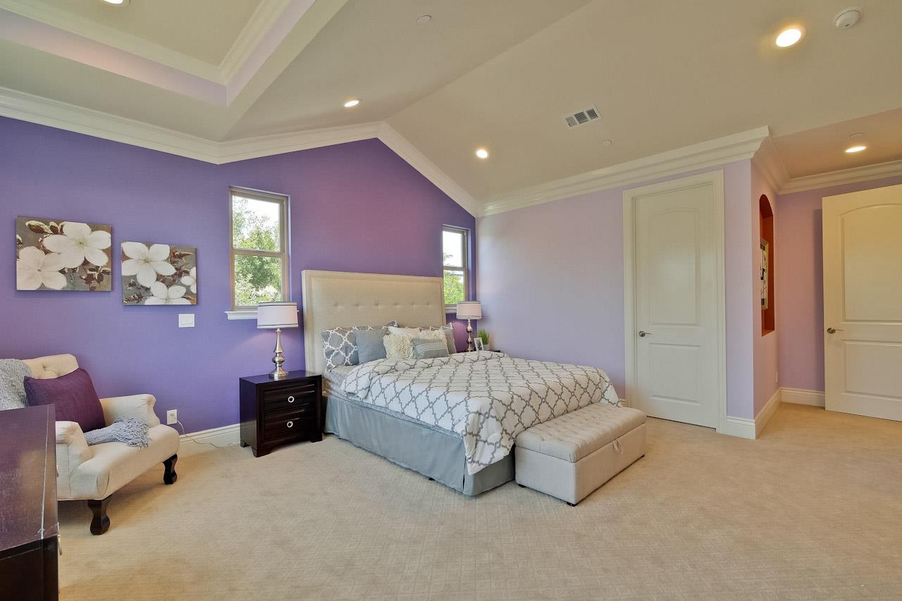 932 Marion Way Sunnyvale, CA 94087 - Photo 38 of 47 a spacious bedroom with a bed and a couch