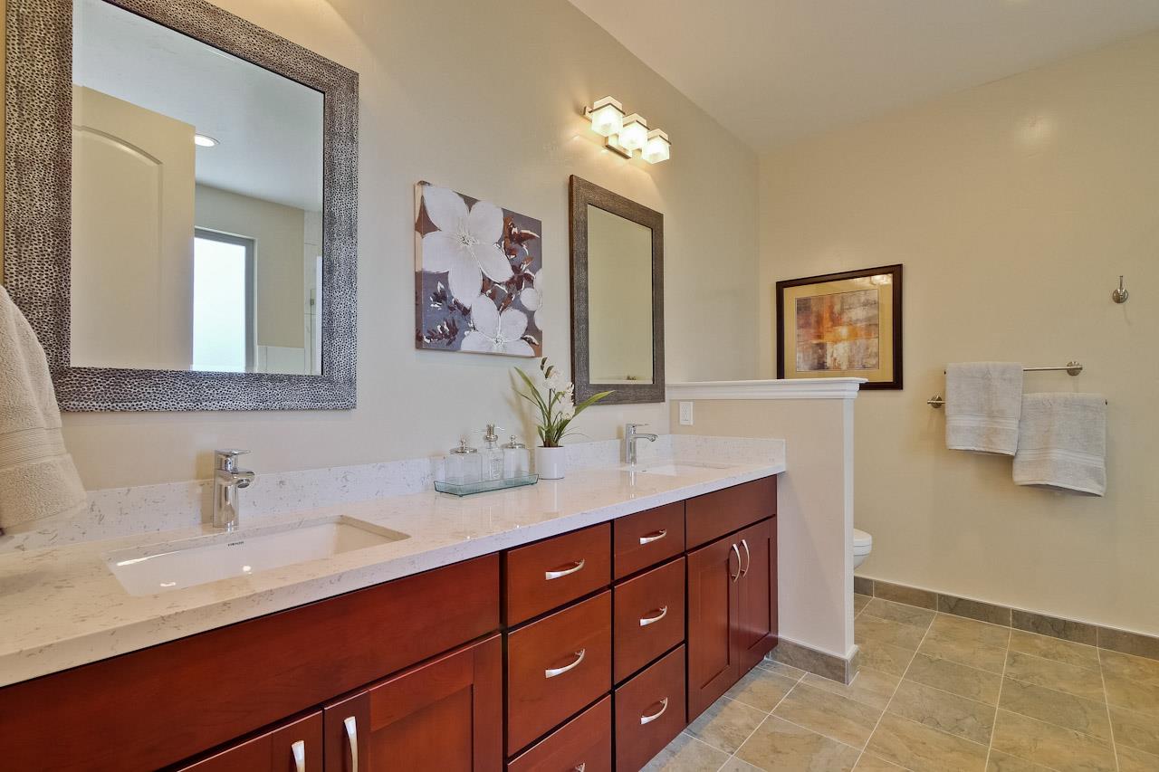 932 Marion Way Sunnyvale, CA 94087 - Photo 40 of 47 a bathroom with a double vanity sink and a mirror