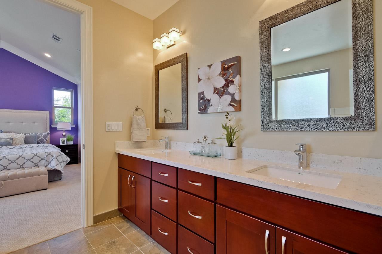 932 Marion Way Sunnyvale, CA 94087 - Photo 41 of 47 a en suite bathroom with double vanity sinks a mirror and a lamp
