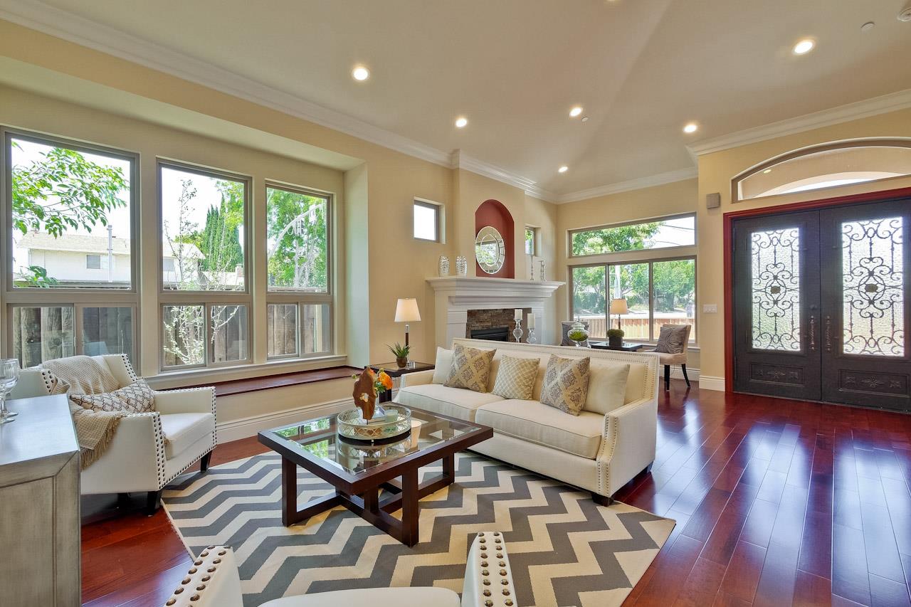 932 Marion Way Sunnyvale, CA 94087 - Photo 5 of 47 a living room with fireplace furniture and a large window