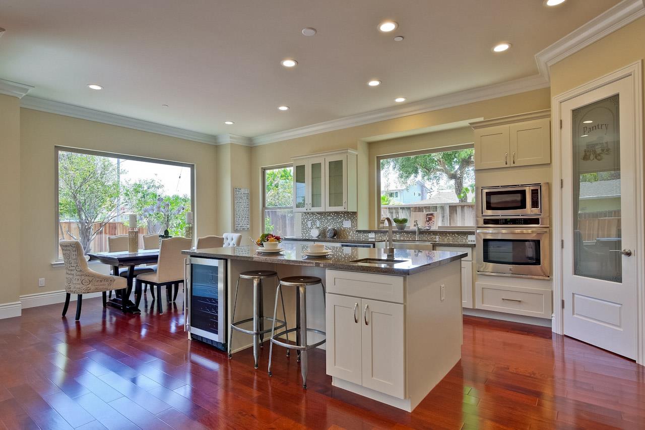 932 Marion Way Sunnyvale, CA 94087 - Photo 10 of 47 a kitchen with stainless steel appliances granite countertop counter top space a stove and a large window