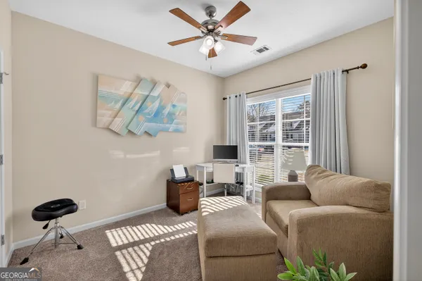 a living room with furniture and a window