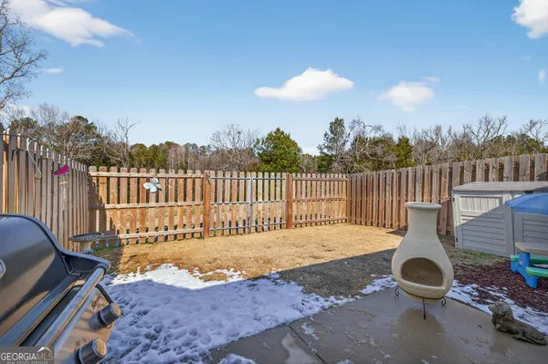 a view of a chairs and tables in the patio