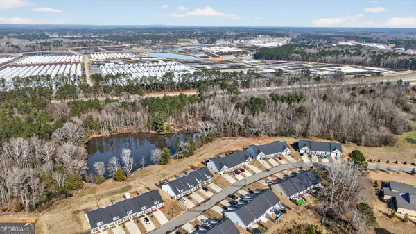 an aerial view of a house with a lake view