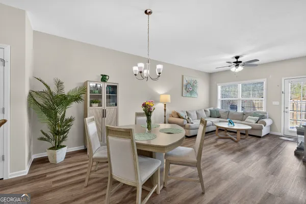 a view of a dining room with furniture window and wooden floor