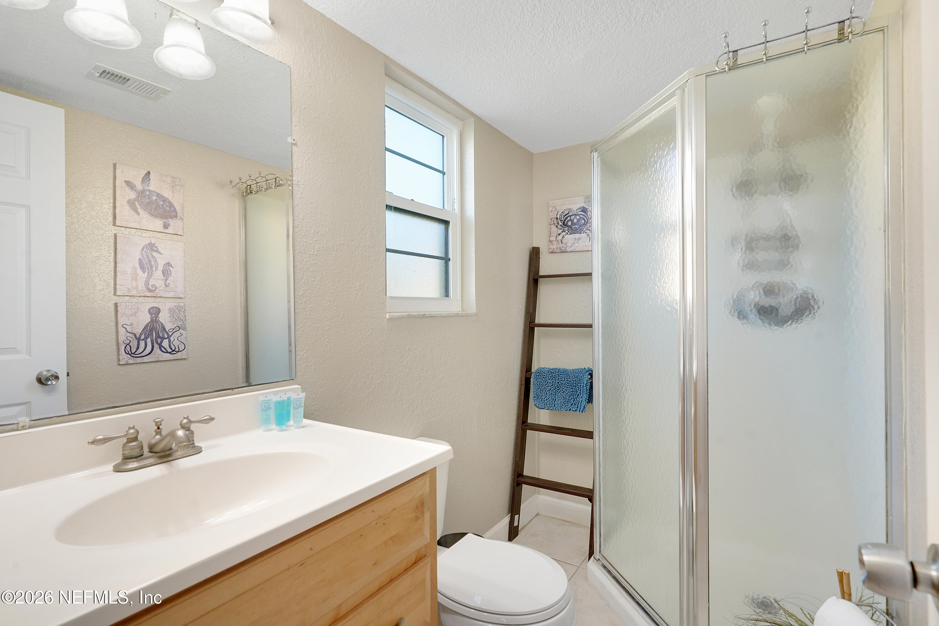 9 Clipper Court St. Augustine, FL 32080 - Photo 15 of 22 a bathroom with a sink toilet and shower