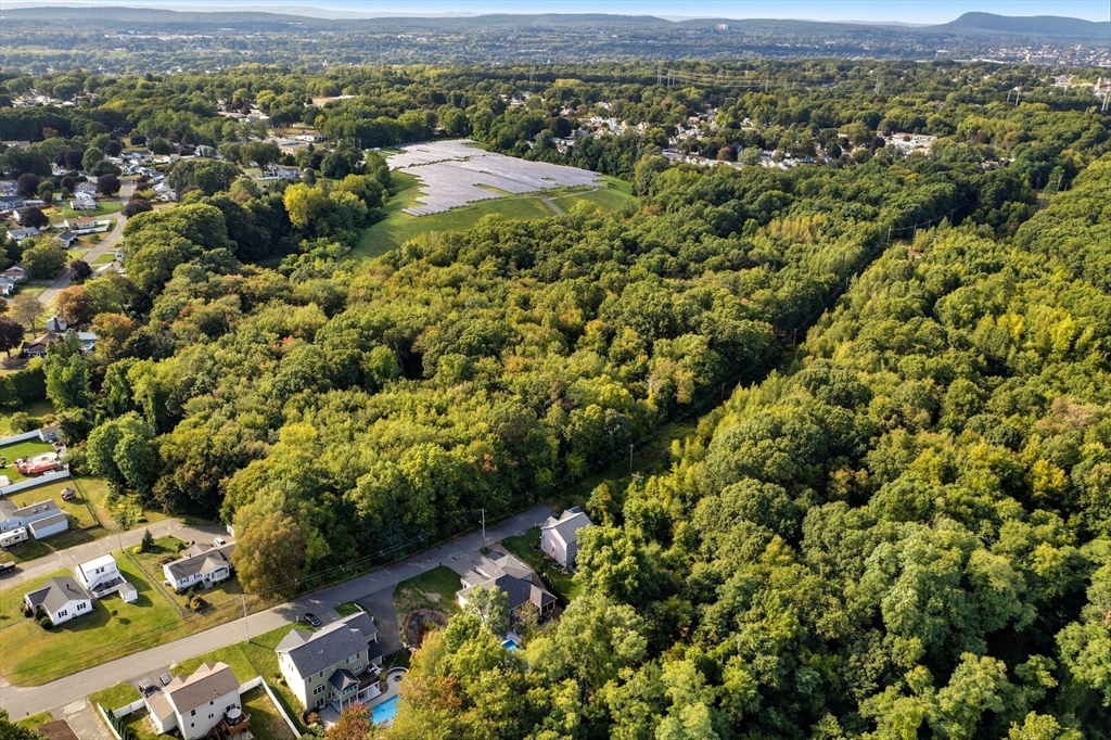 0 Nelson Street Chicopee, MA 01013 - Photo 4 of 9 an aerial view of residential houses with outdoor space and mountain view