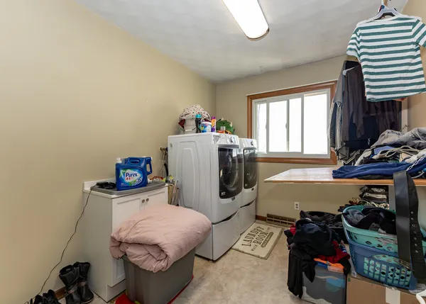 a bedroom with a bed and a table in it